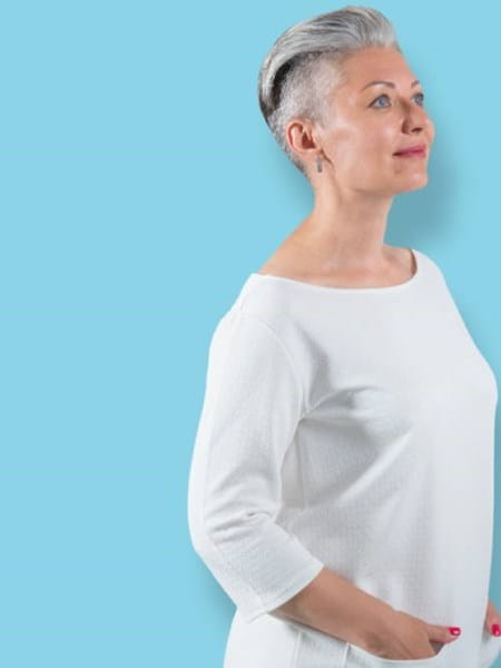 Middle-aged woman with trendy short grey haircut