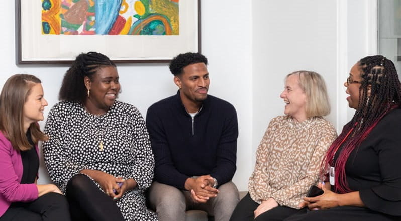 diverse group of people talking