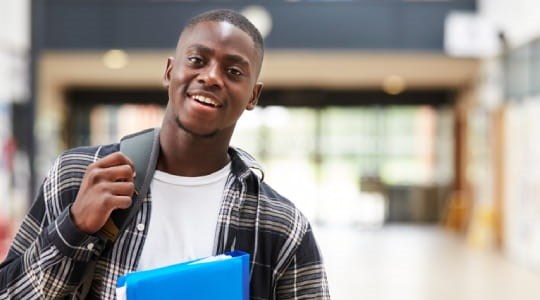 College student holding a folder