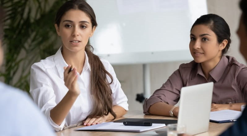 Students studying with books and laptop