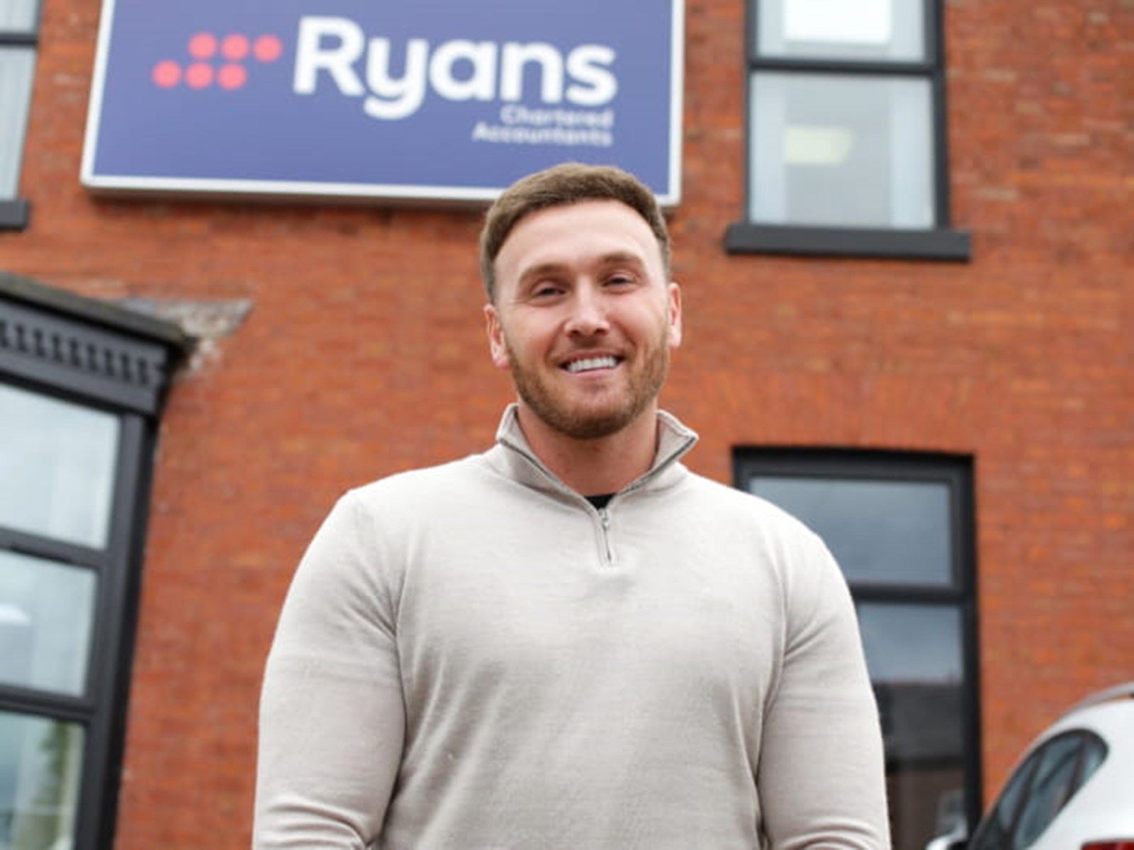 Dale stood in front of Ryan's Chartered Accountants 