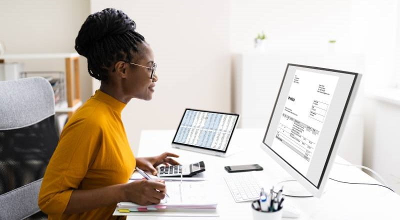 Woman sitting in front of computer