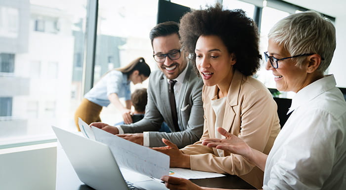 People in an office looking at documents