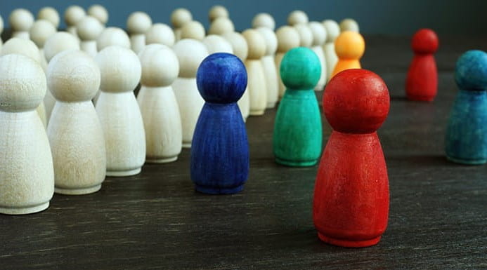 Different coloured pawn-shaped wooden pieces