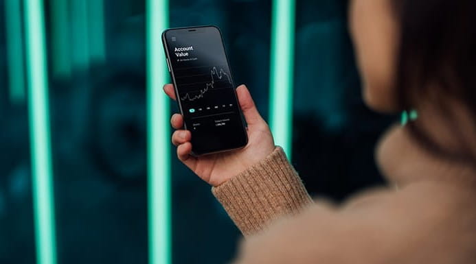 Someone looking at a chart on their smartphone