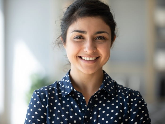Girl smiling in polka dot shirt