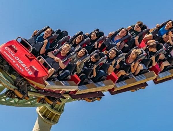 People in a rollercoaster car at Merlin Thorpe Park