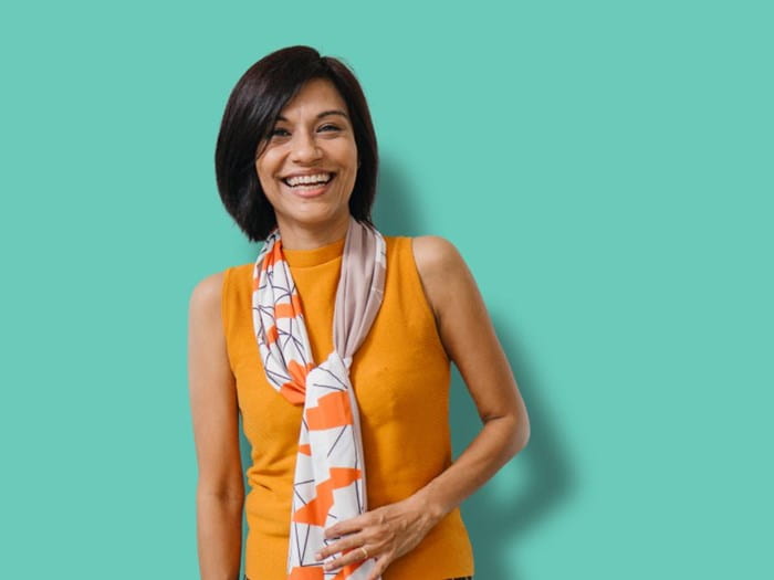 Women in orange top and scarf