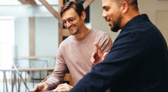 Two men working together