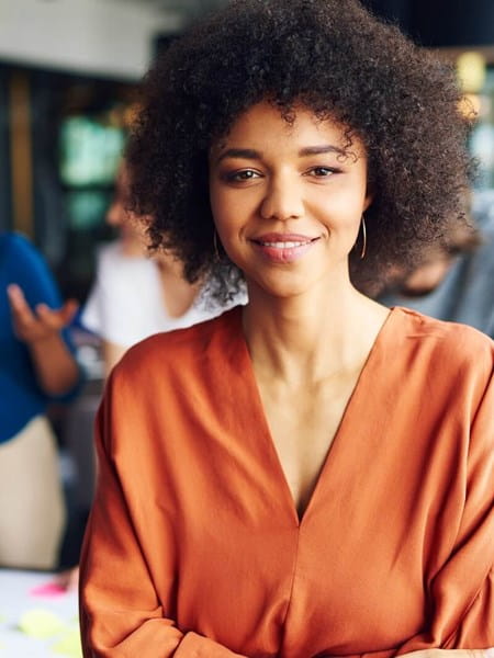 Woman wearing an orange pullover