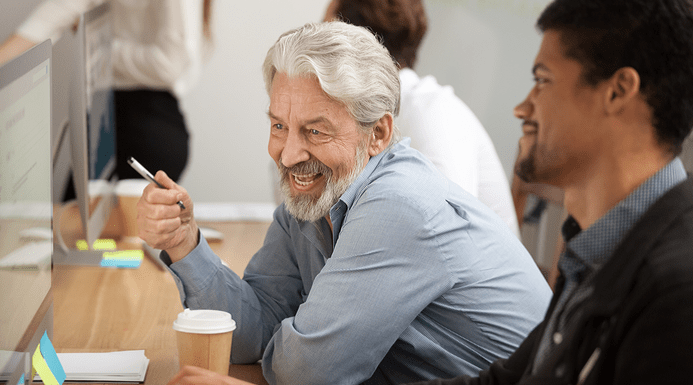 Colleagues looking at a computer screen