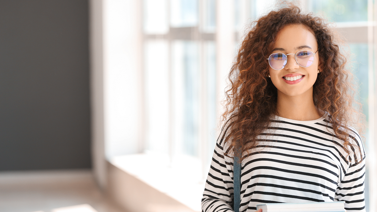 Young lady holding books