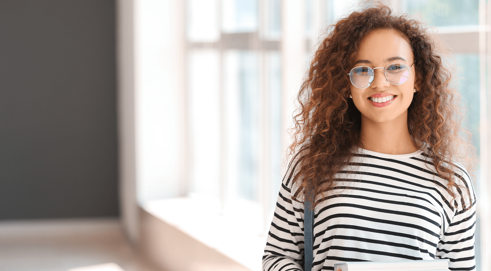 Young lady holding books