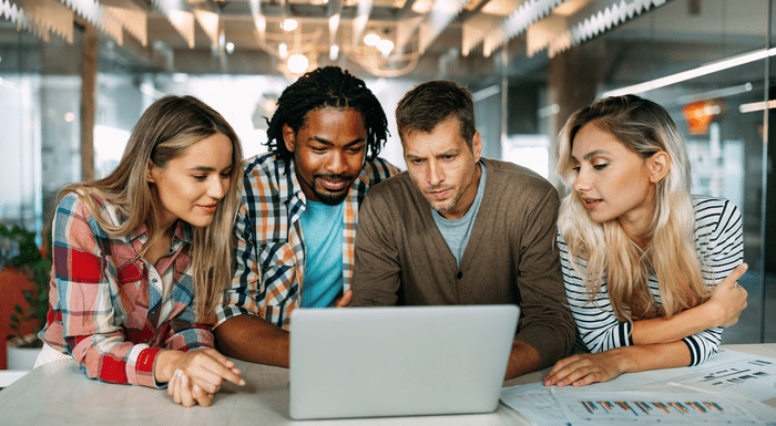 Colleagues looking at laptop