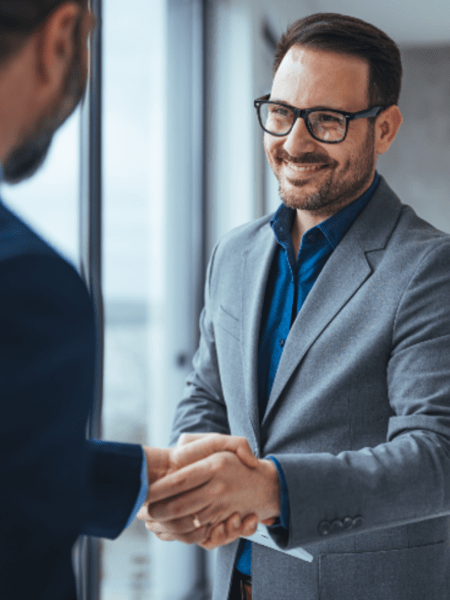 Businessman shaking another businessman's hand