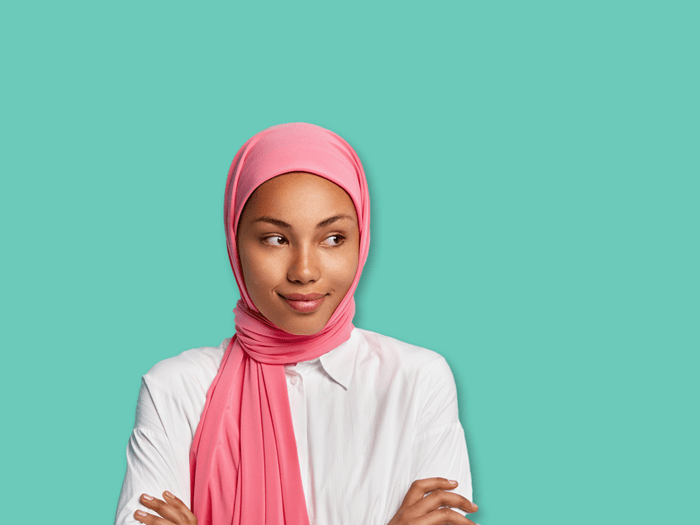 Young woman wearing a pink headscarf